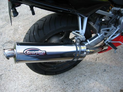 2004 Honda CBR600F - Scorpion exhaust pipe on a motorcycle rear wheel.