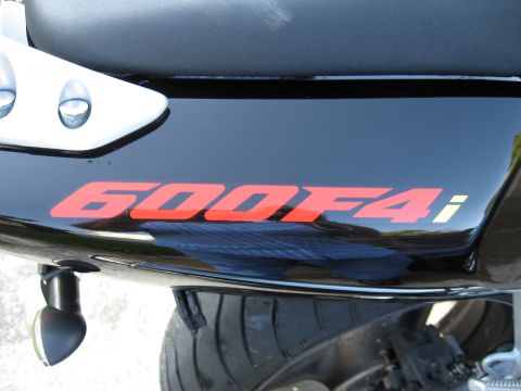 2004 Honda CBR600F - The side of a motorcycle's tail section displays red '600F4i' lettering.