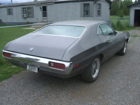 1974 Ford Ranchero - This 1972 Ford Ranchero is viewed from the rear-right angle, showing its distinctive body style and chrome accents.