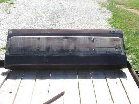 1994 Ford Bronco - A detached tailgate, possibly from a truck or SUV, is shown outdoors.