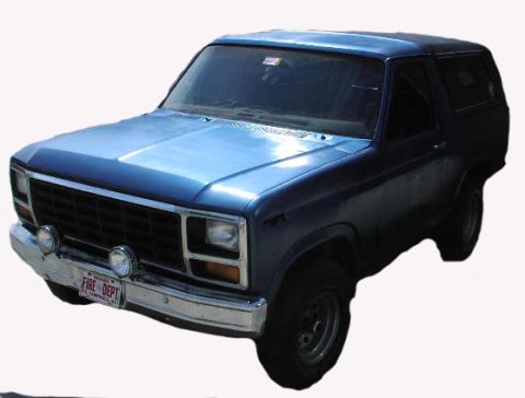 1981 Ford Bronco - Front 3/4 view of a blue 1981 Ford Bronco with a "FIRE DEPT" license plate.