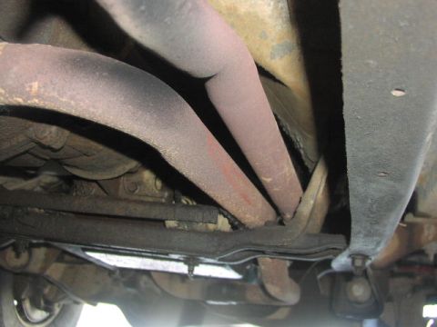1981 Ford Bronco - The photo shows the exhaust system and undercarriage of a vehicle, not specific year or model details.