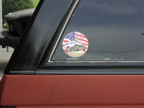 1981 Ford Bronco - A circular sticker with a patriotic theme is affixed to the vehicle's rear window.