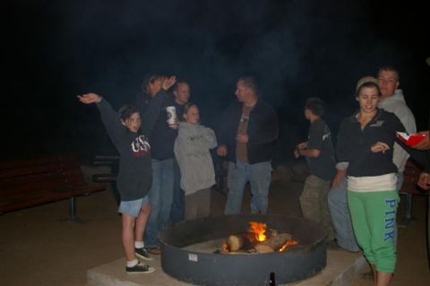 1986 Ford Bronco - Friends and family enjoy a warm campfire under the night sky.