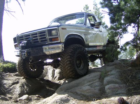 1986 Ford Bronco - This modified Ford Bronco navigates a rocky trail.