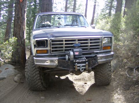 1986 Ford Bronco - This 1986 Ford Bronco is equipped with a winch and off-road tires, ready for terrain.