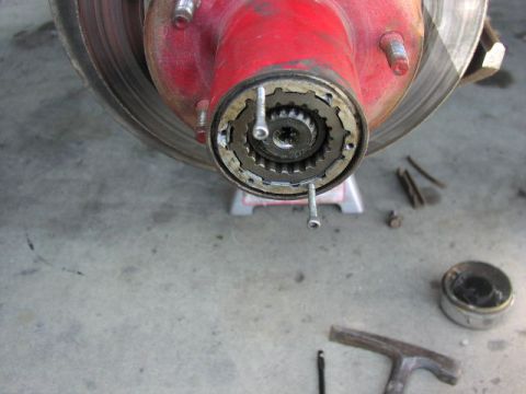 1981 Ford Bronco - Front wheel hub assembly with locking mechanism visible, part of a vehicle repair or maintenance process.