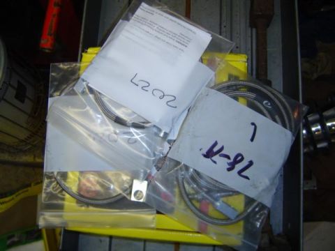 1979 Ford Bronco - Various automotive parts are organized in plastic bags with handwritten labels.