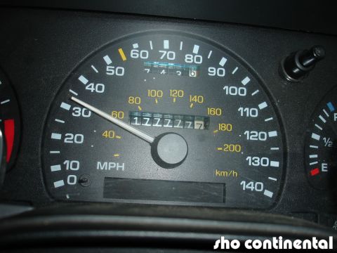 1993 Ford Taurus - Close-up of a car's dashboard, focusing on the speedometer and odometer readings.