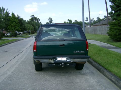1994 Chevrolet Blazer - This Chevrolet SUV has a dark green body with a black top and a trailer hitch installed.