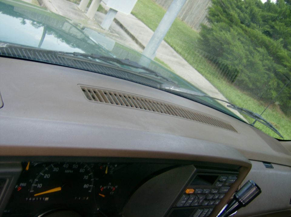 Dashboard interior with speedometer and radio controls visible