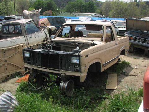 1981 Ford Bronco - Junkyard Bronco, likely early 1980s model, missing parts and sitting on blocks.