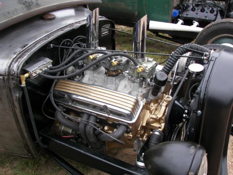 1972 Ford Ranchero - Close-up view of a custom hot rod engine dual carburetors and polished gold valve covers.