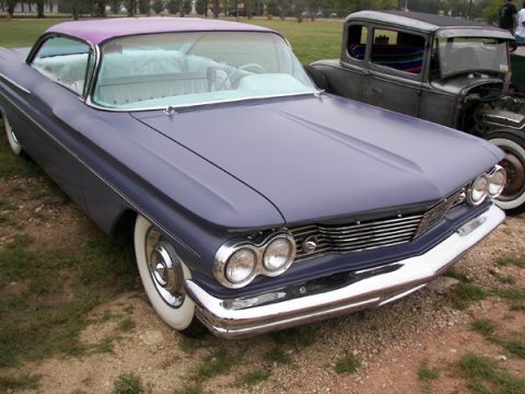 1972 Ford Ranchero - A 1959 Pontiac Bonneville is parked next to a hot rod in an outdoor setting.