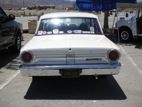 1992 Ford Crown Victoria - Rear view of a 1963 Ford Fairlane 500 sedan parked outdoors. Another vehicle is partially visible on the left.