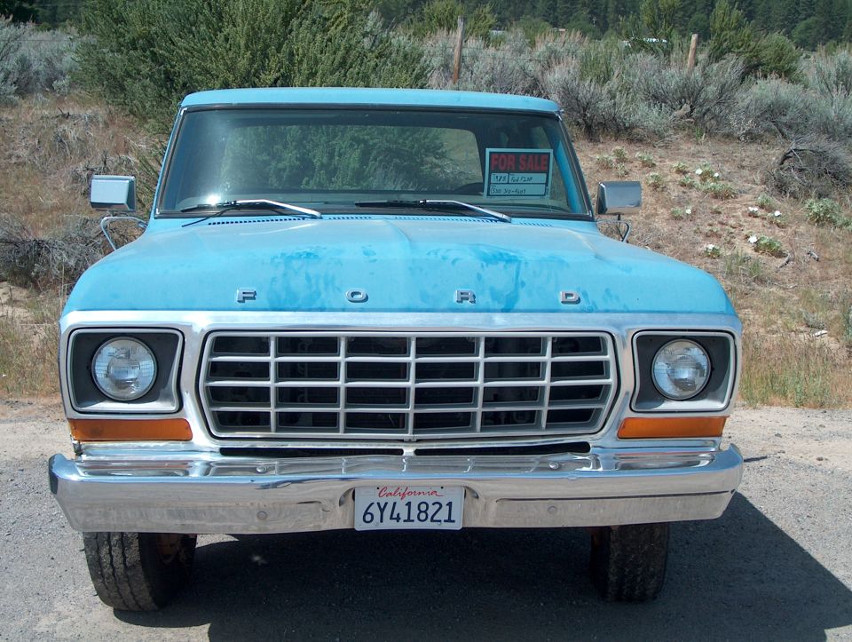 Blue 1978 Ford F-250 truck front view with chrome bumper and grille