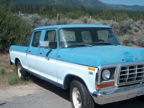 1978 Ford Bronco - This 1978 Ford F-250 crew cab pickup truck is seen from the front quarter angle, a two-tone blue and white paint scheme.