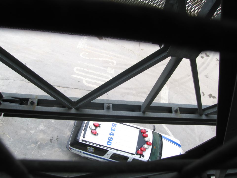 Top-down view through metal lattice of a police car numbered 5340