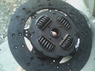 2002 Chevrolet Camaro - Close-up of a vehicle clutch assembly, showing the disc and pressure plate with springs.