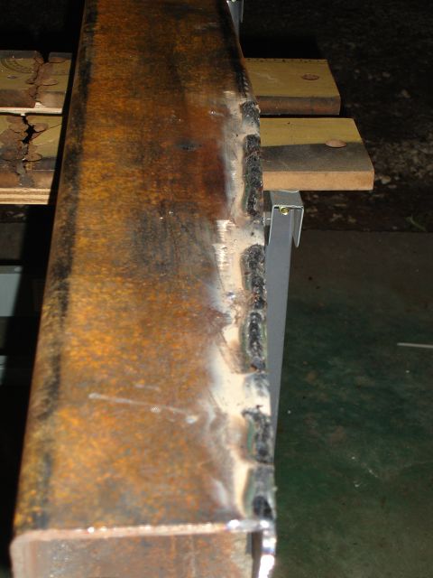 1989 Ford Bronco - Close-up of a rusty, welded metal beam, likely a custom part, with a Supermotors.net watermark.