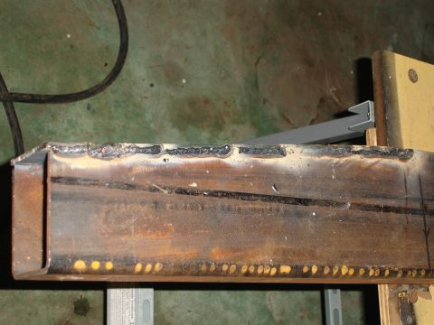 1989 Ford Bronco - A close-up view of a welded metal beam, showing construction details.
