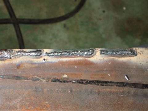 1989 Ford Bronco - Close-up of a welded metal seam, showing the weld beads and some surface rust.