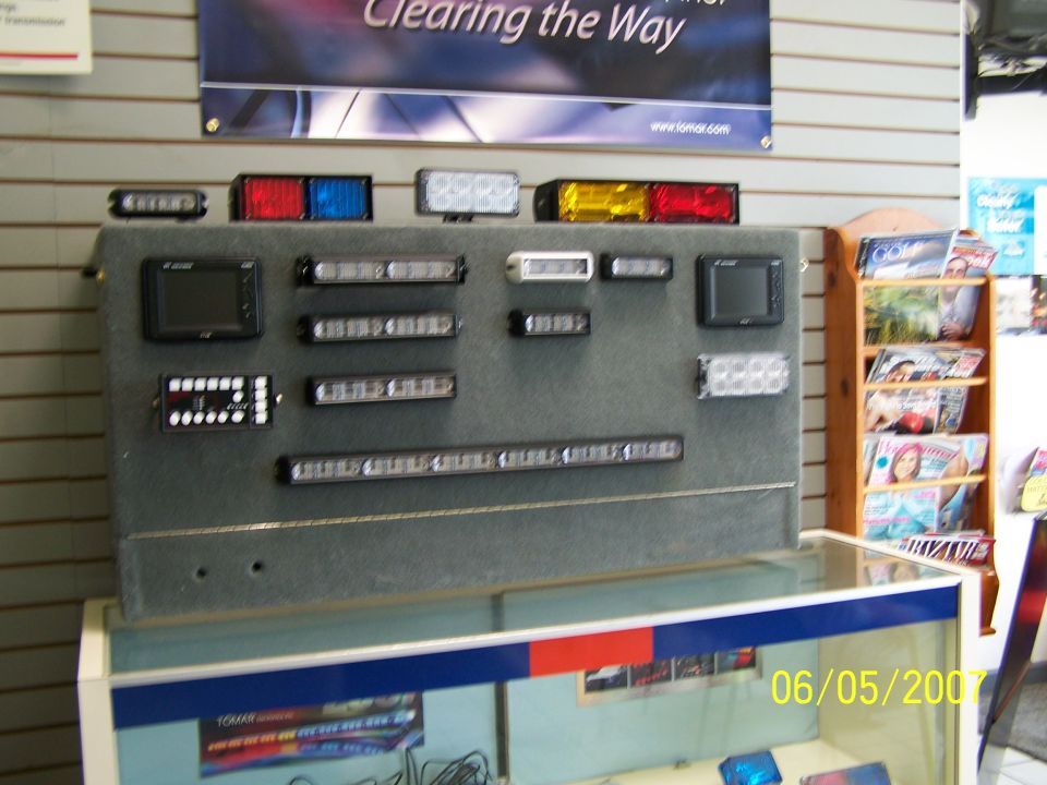 Display board with various LED light bars and modules, red, blue, white, and amber colors