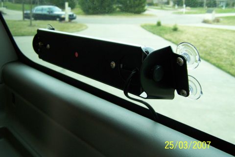 2003 Ford Crown Victoria - Interior light bar mounted on a car window, with a vehicle visible through the windshield.