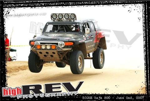 1992 Ford Explorer - This modified SUV is captured mid-air during an off-road race.