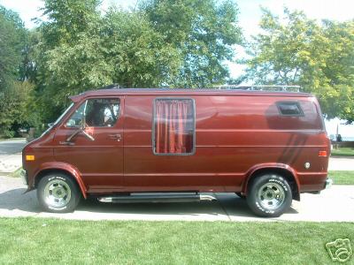 1978 Ford E250 - This 1978 Ford E250 van is shown from the side, a brown paint job and custom wheels.