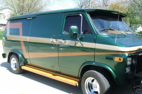 1978 Ford E250 - This 1978 Ford E250 van is seen from the front-right, a green and gold paint scheme with custom running boards.