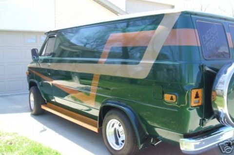 1978 Ford E250 - This 1978 Ford E250 van features a distinctive green paint job with gold and brown stripe graphics.
