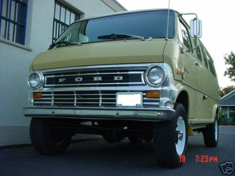 1978 Ford E250 - This 1978 Ford E250 van features a prominent chrome grille and dual headlights, presented in a front-facing view.