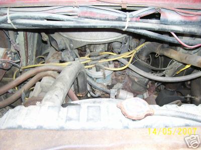 1978 Ford E250 - Close-up view of the engine compartment of a 1979 Ford E350 workbox, revealing the V8 engine and associated components.
