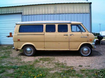 1978 Ford E250 - Side view of a tan van with a camper top.