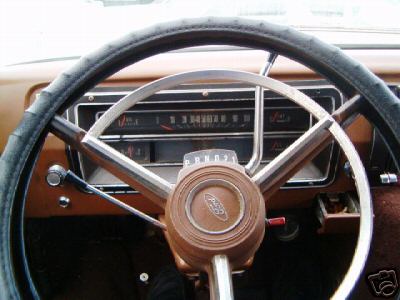 1978 Ford E250 - The interior of a Ford van shows the steering wheel, dashboard, and gauges.