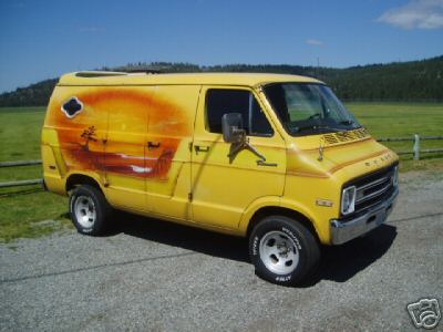 1978 Ford E250 - A yellow full-size cargo van shown from a 3/4 front angle, featuring an airbrushed sunset/desert mural on the side panel. It sits on chrome…