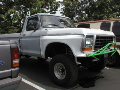1979 Ford Bronco - A modified 1979 Ford F-Series pickup truck is parked next to a newer Ford Ranger.