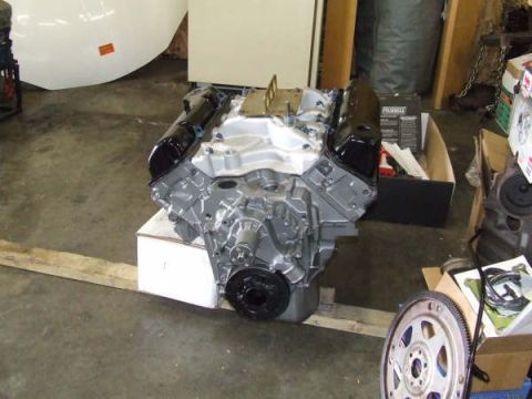 1979 Ford Bronco - A V8 engine block is shown, likely for a project vehicle, with various parts in the background.
