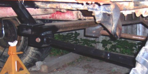 1978 Ford Bronco - The underside of a vehicle is shown, with focus on the suspension and frame components.