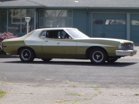 1973 Ford Torino - Side view of a 1973 Ford Torino coupe with a two-tone paint scheme.