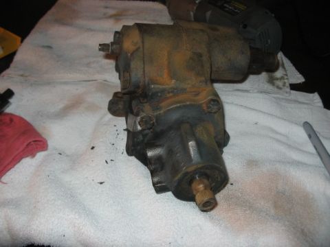 1991 Ford Bronco - A dirty and rusty power steering gearbox sits on a white towel, possibly awaiting repair or replacement.