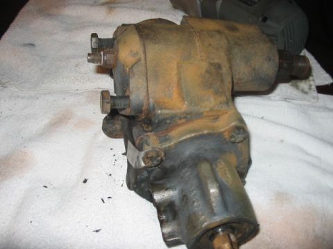 1991 Ford Bronco - A close-up view of a used steering gear box, showing signs of wear and rust.
