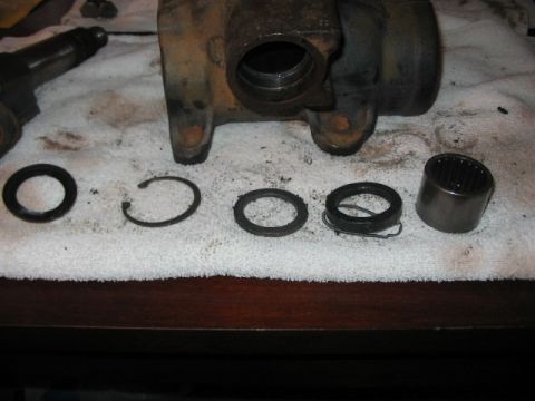 1991 Ford Bronco - Disassembled hydroboost cylinder components laid out on a white towel.