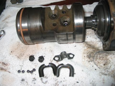 1991 Ford Bronco - Disassembled hydroboost brake booster assembly components laid out on a cloth.