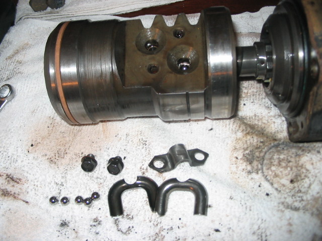 Hydroboost brake booster assembly with disassembled components including balls and brackets