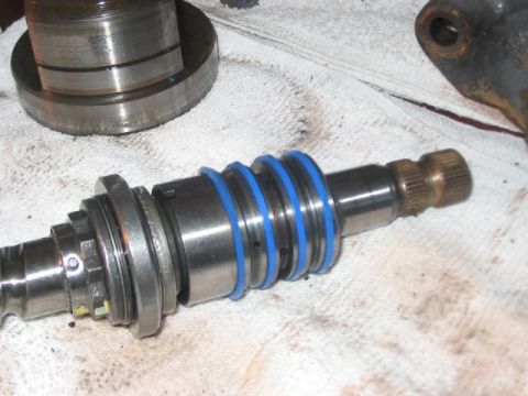 1991 Ford Bronco - A disassembled steering gear shaft with blue O-rings is shown on a white cloth.