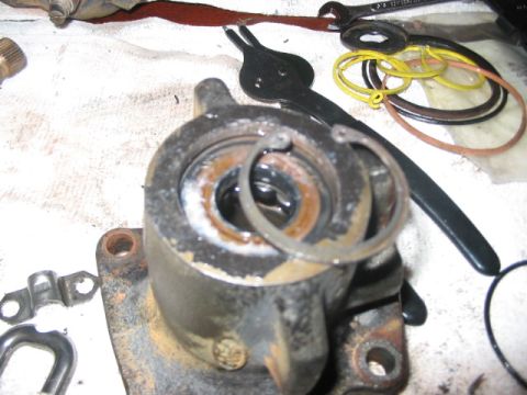 1991 Ford Bronco - Close-up of a disassembled hydroboost cylinder, showing internal components and repair parts.