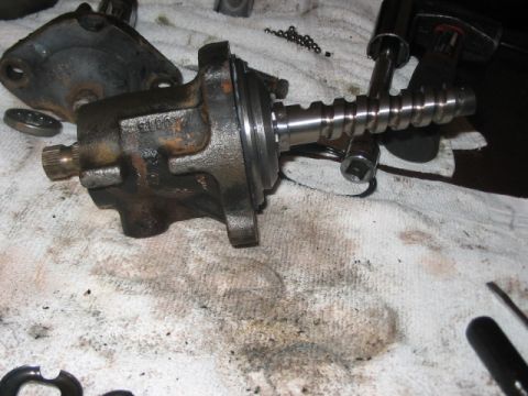 1991 Ford Bronco - A disassembled steering gear box sits on a dirty rag, ready for repair or replacement.