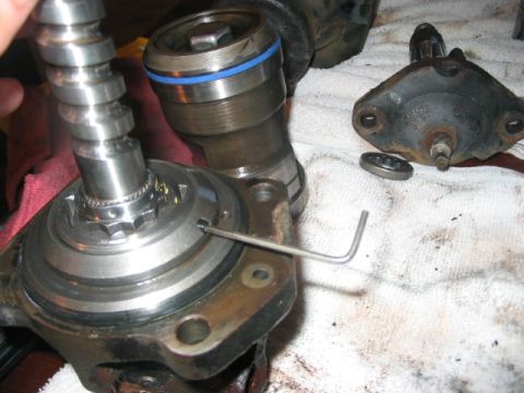 1991 Ford Bronco - Close-up of a hydroboost unit with a hex wrench being used for adjustment.
